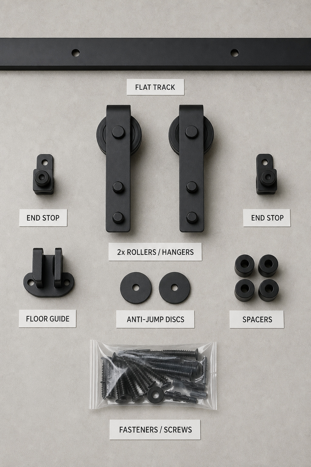 Flat-lay of a complete barn door hardware kit showing track, rollers, end stops, floor guide, anti-jump discs, and mounting hardware