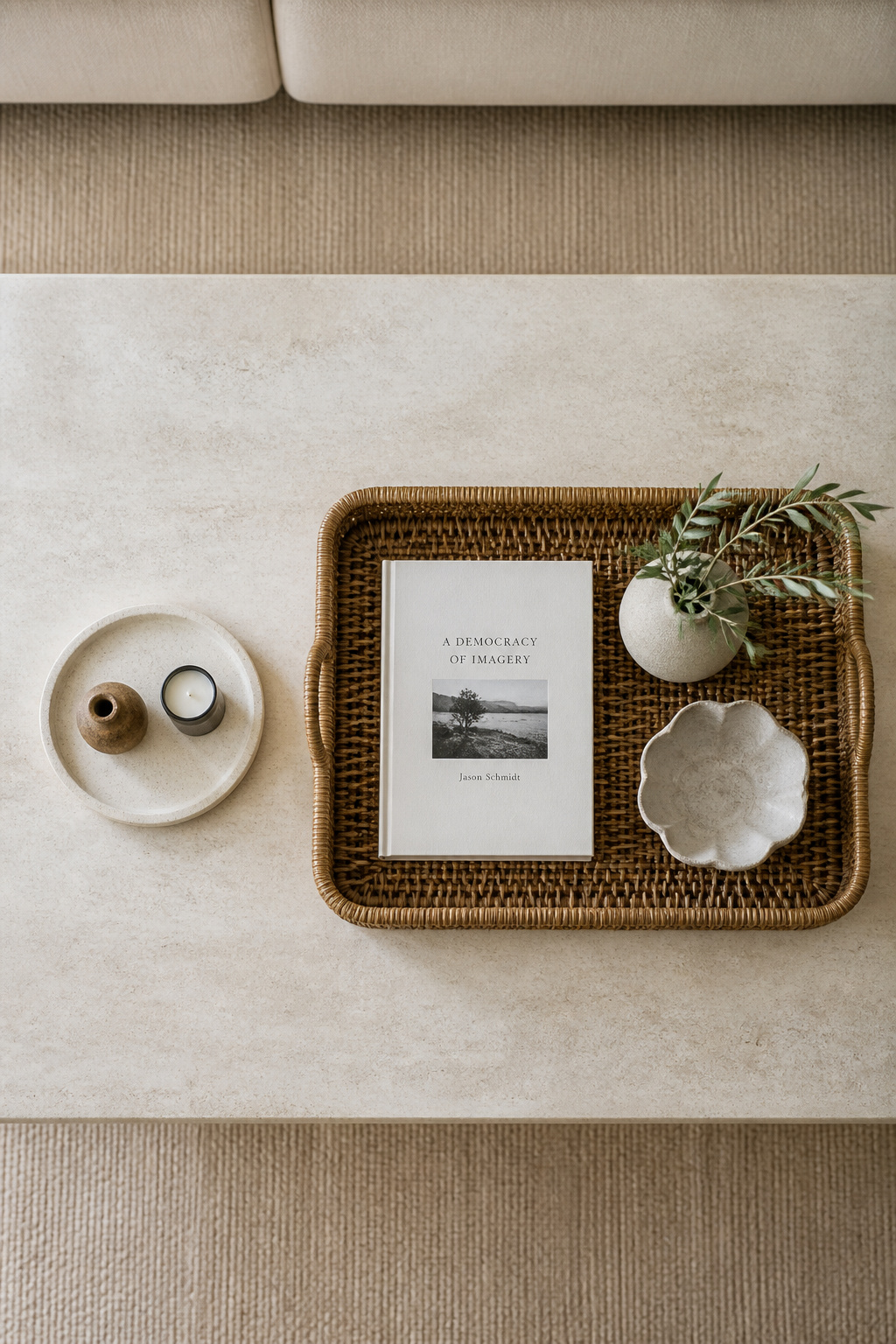 Overhead comparison of a small tray that floats versus a correctly proportioned rattan tray that anchors the coffee table surface