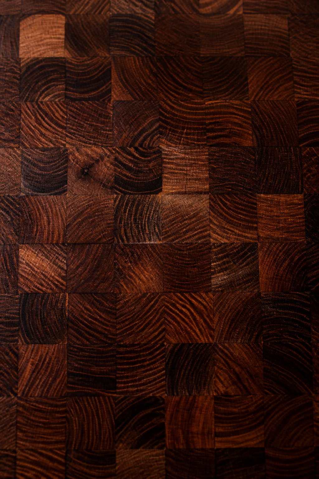 Oiled end-grain walnut butcher block island top showing checkerboard growth-ring pattern