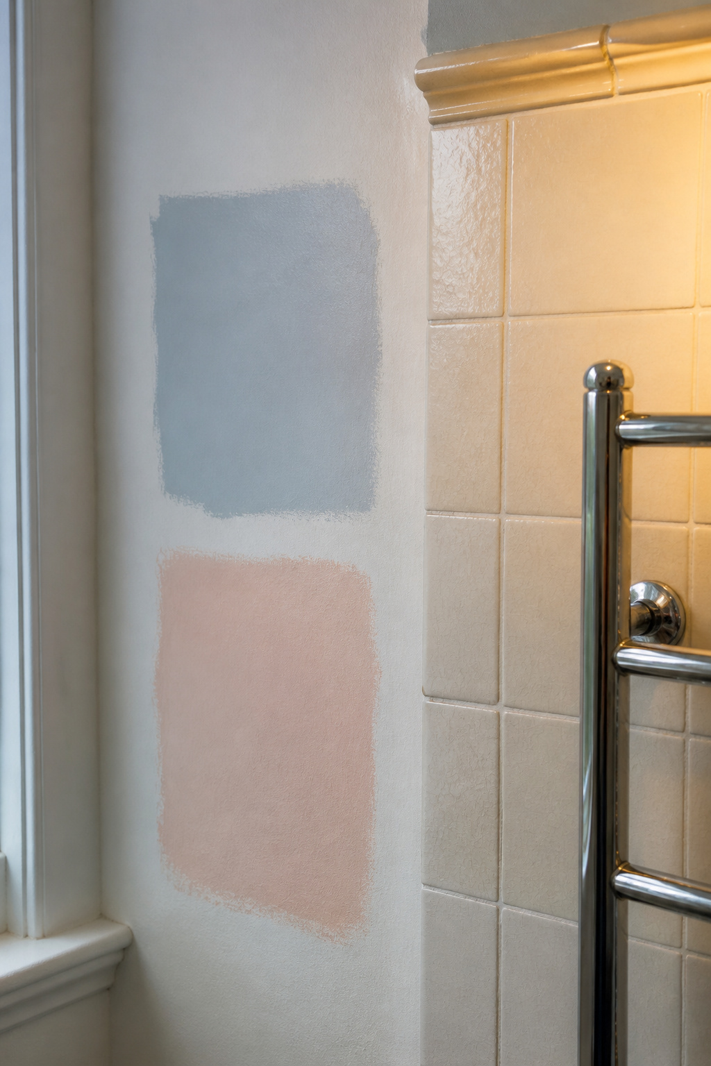 Bathroom test patches of period pastel paint colours alongside vintage ceramic tile showing colour assessment process