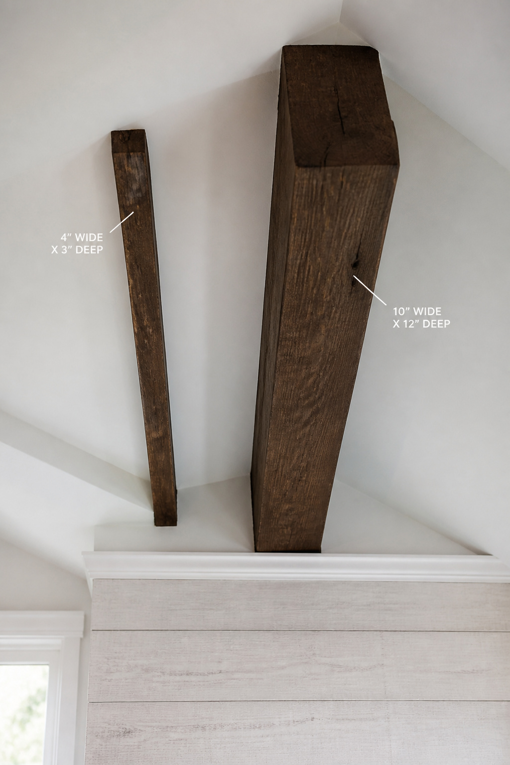 Two ceiling beams on a vaulted ceiling showing the scale difference between an undersized 4×3 inch profile and a correctly proportioned 10×12 inch beam