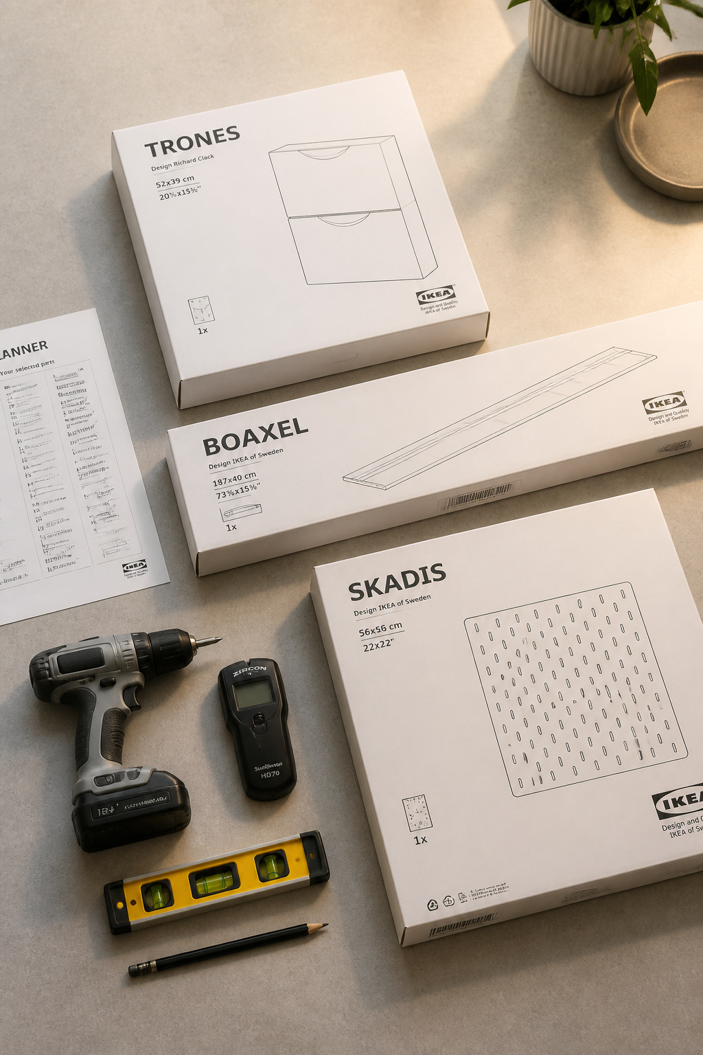 IKEA laundry room hack tools — cordless drill, stud finder, level, and IKEA product boxes for TRONES, BOAXEL, and SKADIS