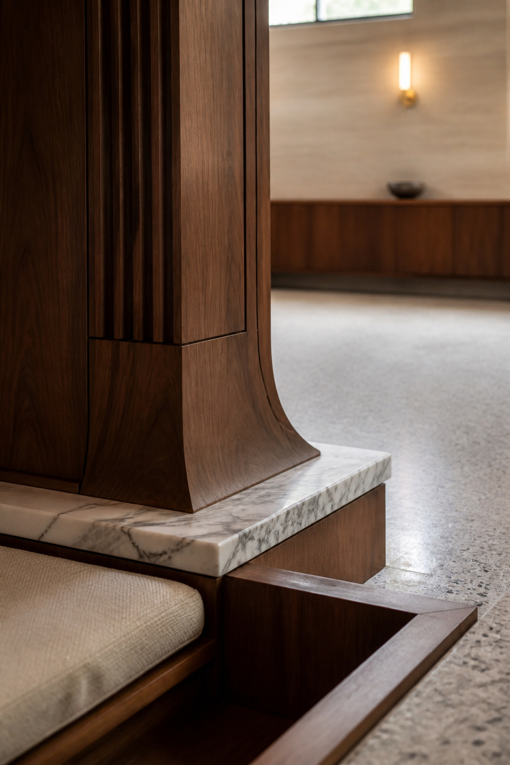 Walnut-clad structural corner support and marble step coping in an original mid-century sunken living room