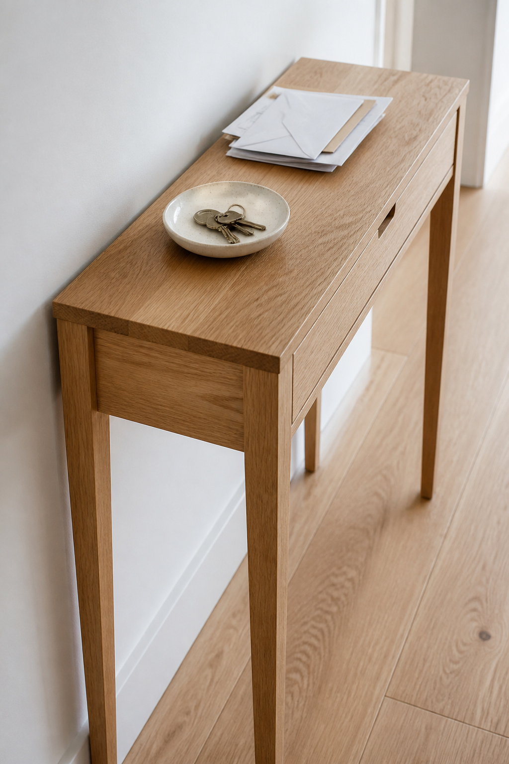 Solid wood console table sized for a narrow entryway hallway with keys and mail on top